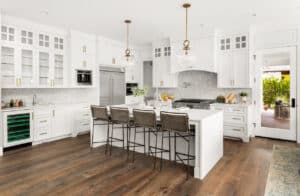 Modern 2025 open floor kitchen with an island in the middle with chairs